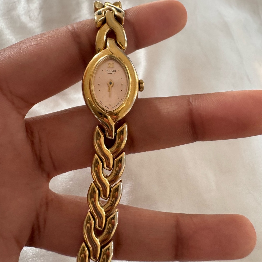 Pulsar Gold Watch with Intricate Chain Design